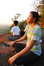 Students meditate during visit to Forest Temple
