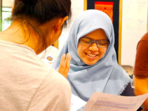 Annisa conversing during a classroom session