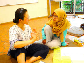 Annisa conversing during a classroom session