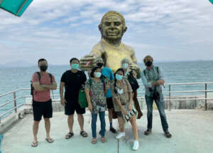 Posing with a Figure from a Famous Thai Folktale
