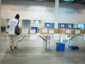 A guest looks for a book at the shelter's library.