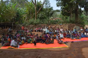 Visitors meeting with tribal community
