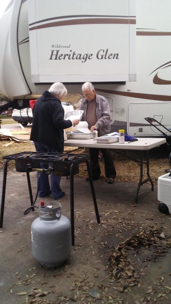Gordon's Mom and Dad frying fish for volunteers