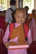 Receiving her backpack +  supplies + new robe!