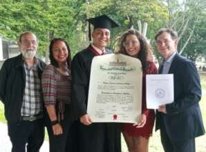 Brayan with family and his FOF mentor @ graduation