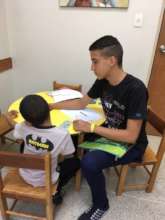 Moises testing a child during his internship