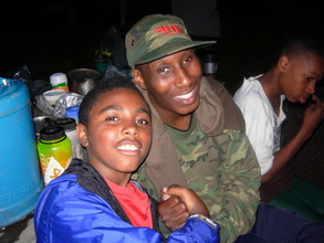 Enjoying time together in the evening around the riverside fire.