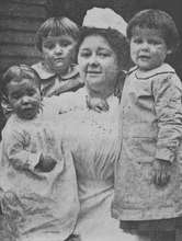 Sheltering Arms children and "matron," 1909