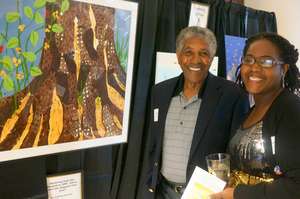 Guests bid on artwork by Sheltering Arms children