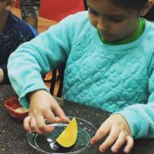 Coastal Bend Food Bank (Corpus) child tries squash