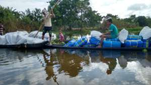 GOONJ team delivering relief kits