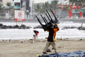 A man prepares for Hurricane Katia