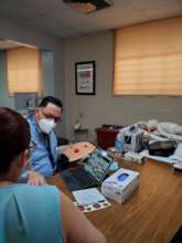 A provider uses a tablet for health education