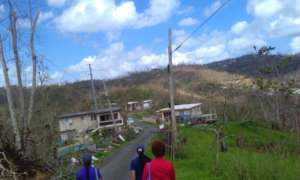 SANOS staff assess the damage in their community