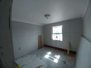 Peter's house with fresh drywall and insulation