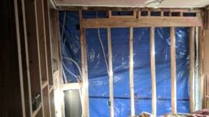 Another house that had to use tarps for walls