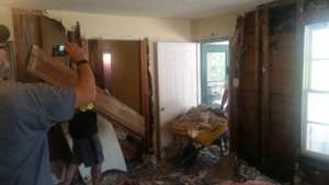 A mucking crew working on the house from the...