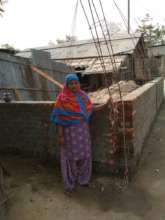 Meena, whose house has been reubuilt