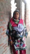 Beneficiary 4- In front of her house