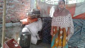 Beneficiary 3- In front of her house