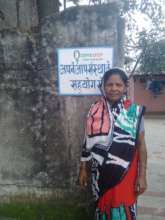 Sajda Khatoon in front of her home