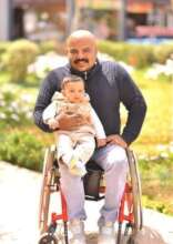 Ramy with his newly born child