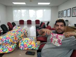 Rafael explaining cloth diapers at the Diocese