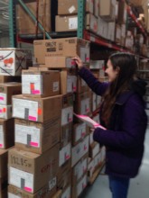 A Global Links volunteer labels boxes for Cuba.