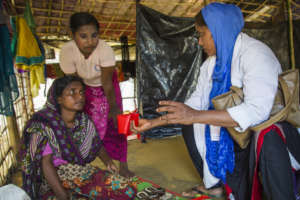 Dr. Akter and Rohingya community working together