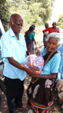 Neglected elder eagerly receiving food groceries