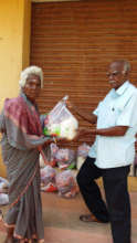 Neglected elder eagerly receiving food groceries