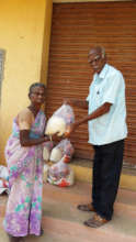 Neglected elder eagerly receiving food groceries