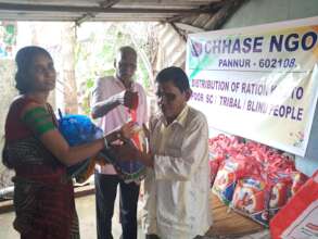 Blind people receiving food groceries