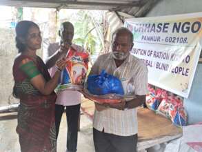Blind people receiving food groceries