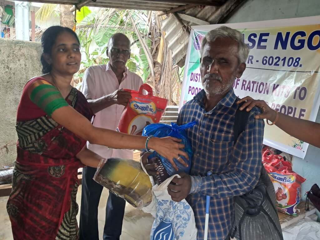 Blind people receiving food groceries