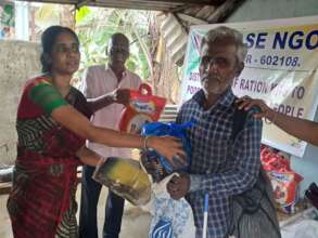 Blind people receiving food groceries
