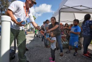 Waiting at a distribution in Immokalee, Florida