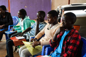 Youth engage in a peer educator training at AMS.