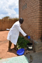 A Health officer getting water at Chiunjiza