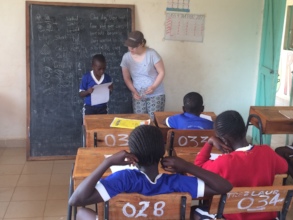 Volunteer libby helping with literacy classes