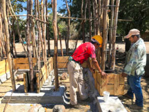community promoters building with local materials