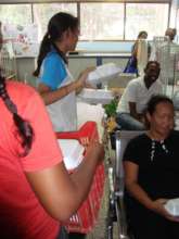 Volunteer giving the meals to child patients