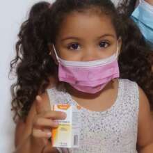 Happy child  receiving  essential medicine