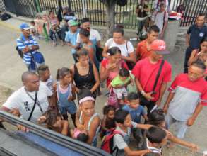People Waiting for Meals Distributed by SAI