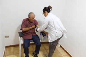 Collecting a blood sample from one of our patients