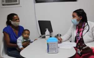 Mother and baby receiving  baby formula