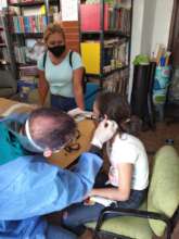 SAI medical Doctor examines orphan girl's ears.