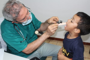 Young child receiving a check up from SAI doctor!