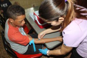 Happy kid getting tested