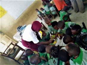 Nofisat distributing school supplies